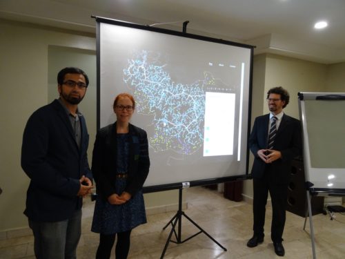 Presentation of preliminary results for grid extension and mini-grids. F. l. t. r.: Muhammed Imran (INTEGRATION Environment & Energy GmbH), Catherina Cader (RLI), Philipp Blechinger (RLI). 